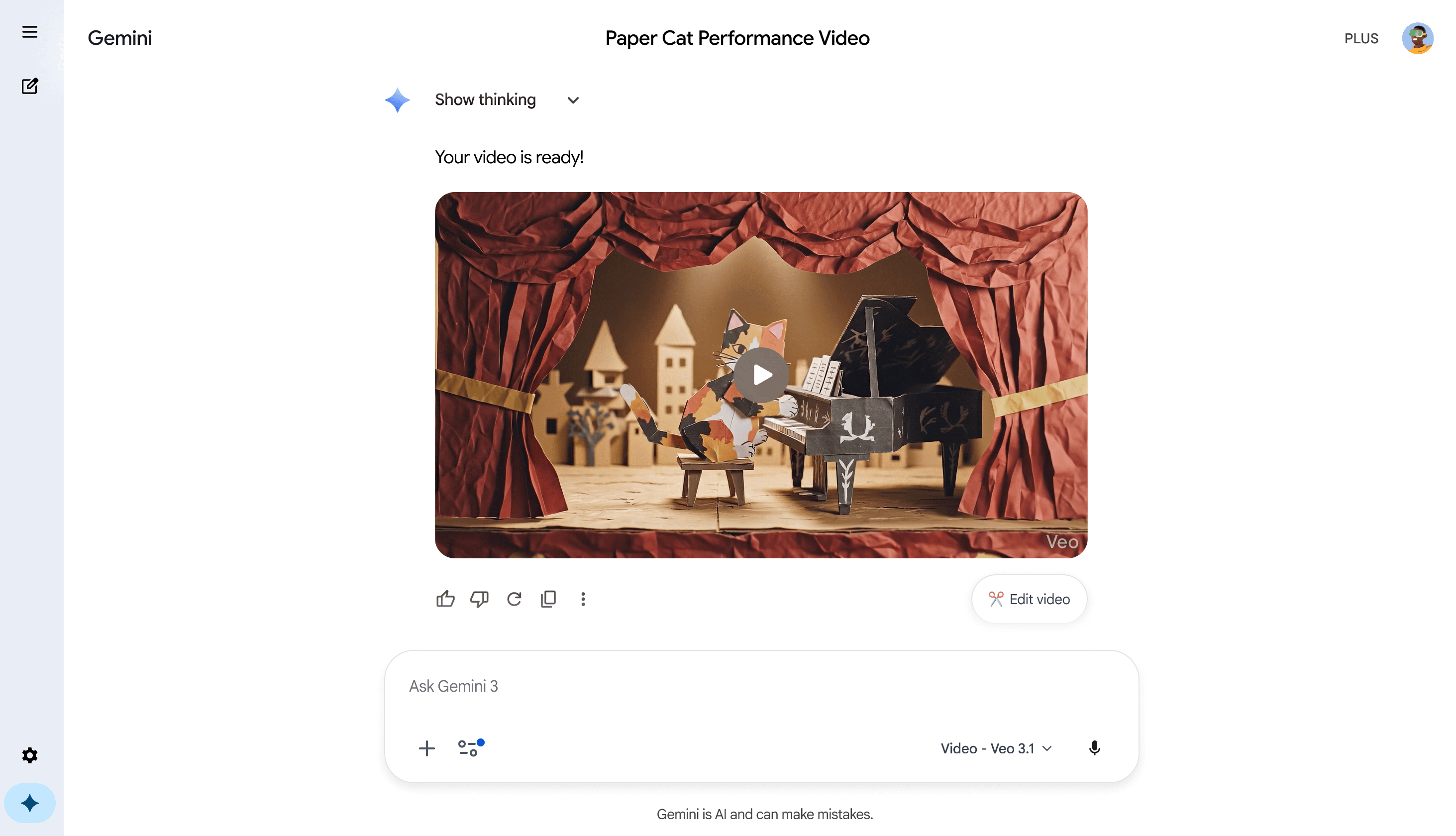 A generated “Paper Cat Performance Video” playing inside Gemini's chat, showing a puppet-theater stage with a paper cat performing at a tiny paper piano.